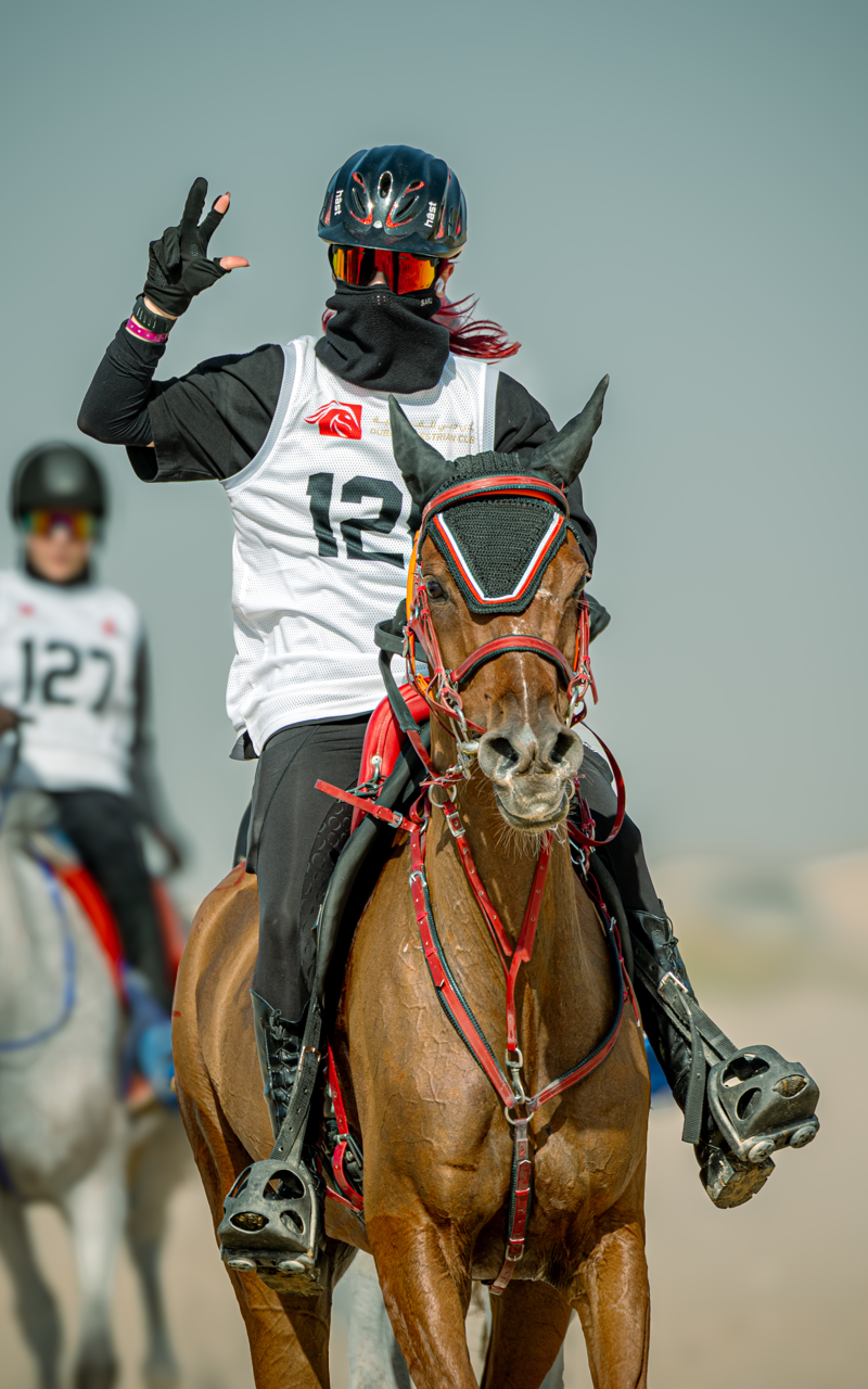 Endurance rider celebrating during desert race